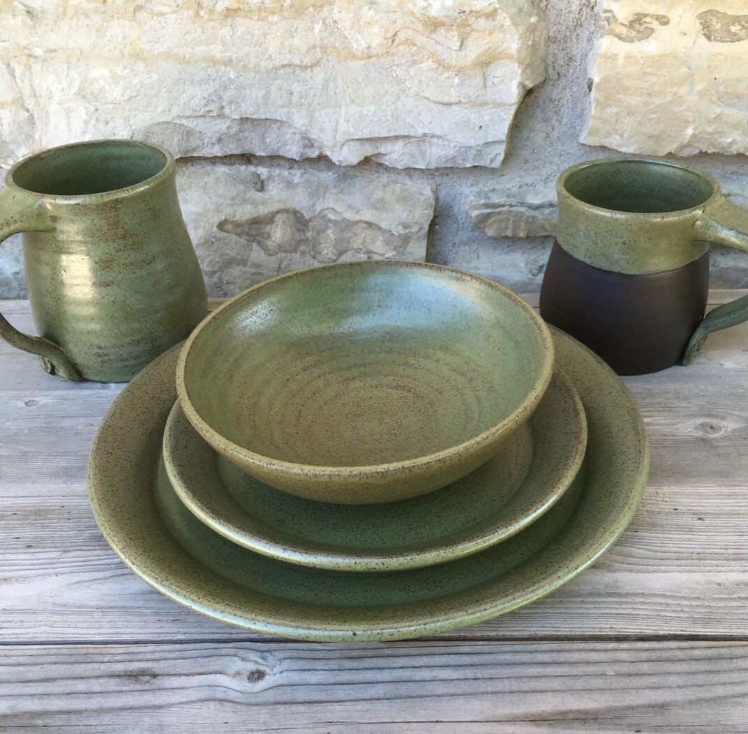 4pc pottery dinnerware place setting in tea green on dark clay