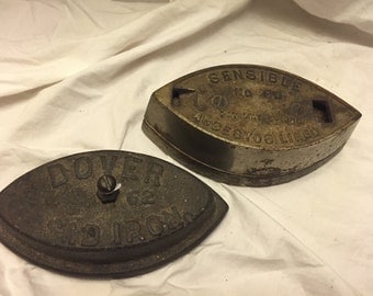 Lot of 2 Antique iron Sad irons Sensible 80 and dover 62 no handles great paperweights