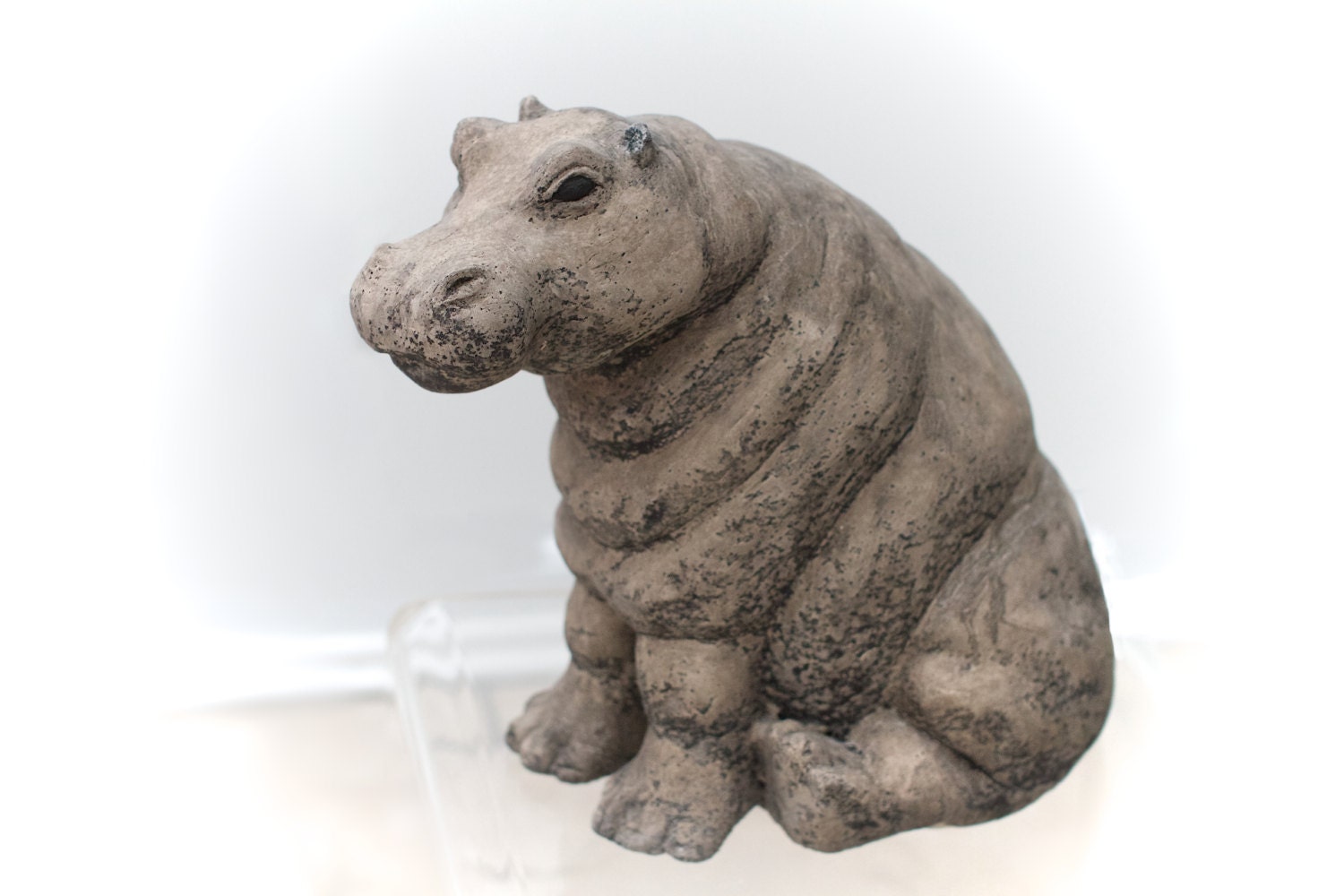 Stone Hippo sculpture. Garden sculpture