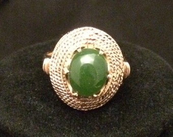 Elegant and bold, 10k gold with green jade center stone