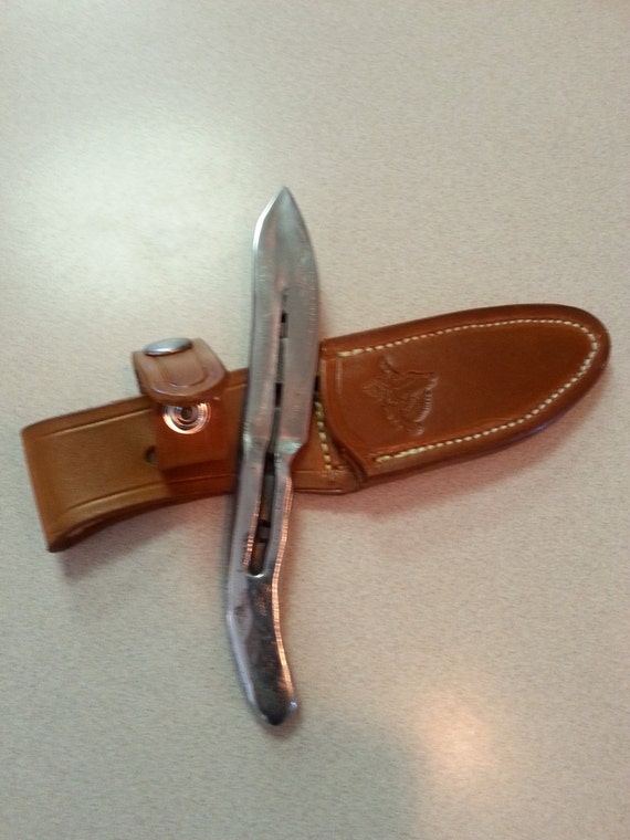 Hand horseshoe knife w/snake skin and by