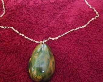Vintage end of day green Bakelite pendant necklace with gold metal chain