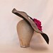 Stunning handmade gunmetal coloured contrast hat decorated with a large hot pink rose