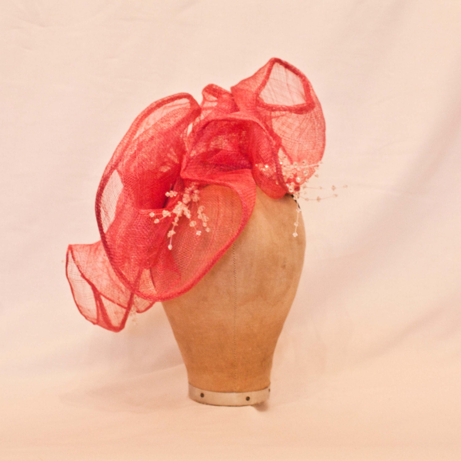 Beautiful handmade hot pink frill ladies side hat decorated with delicate beading