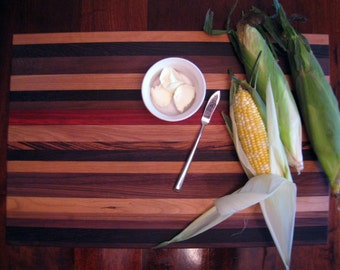 large exotic multi-wood cutting board serving board