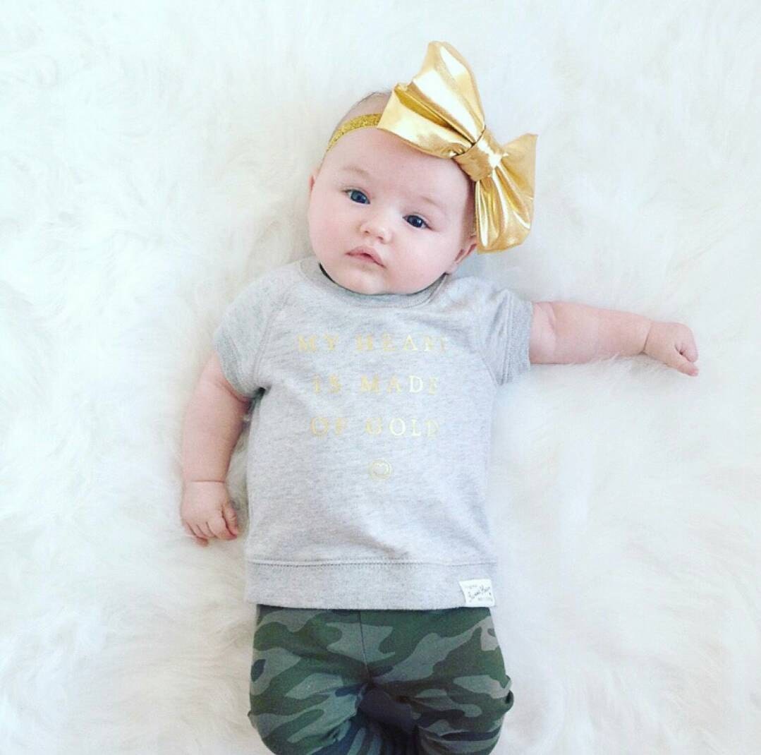 Baby girl metallic gold bow headband by SparkleGloriously on Etsy