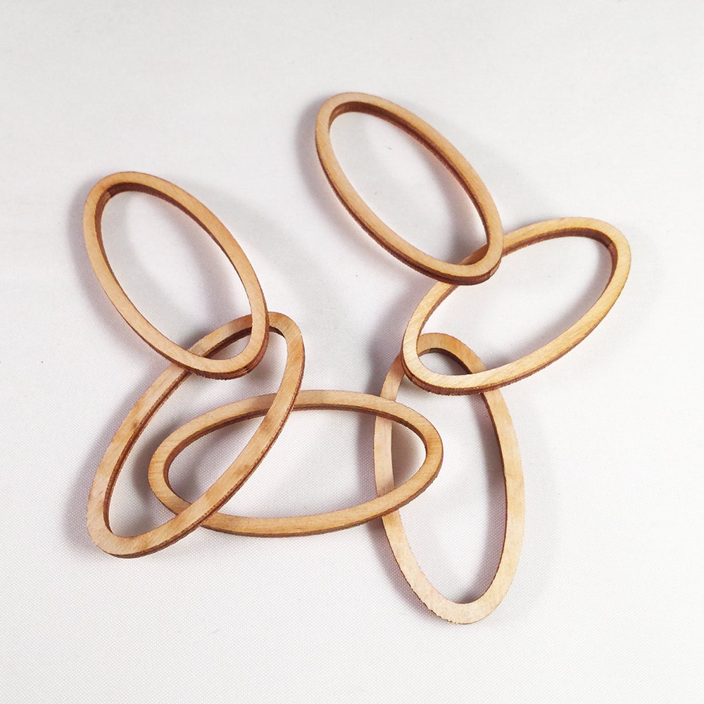 6 laser cut oval frames. Unfinished wood. Jewelry supply.