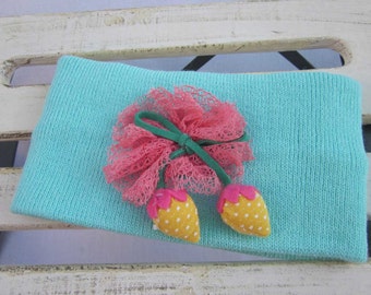 Baby hats for girls or baby winter headband is soft and warm features lace, leather bow and 2 pom pom strawberries. A Fashion Baby must have