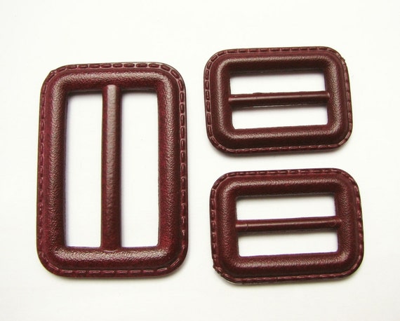 Dark red buckles in leather imitation trench coat buckles