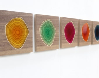 Five wall sculptures in carved wood and colorful resin