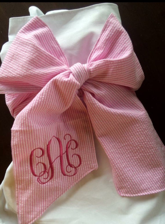 Monogrammed bow swaddle blanket personalized pink seersucker