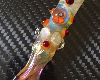 Glass piece fumed one hitter. SOUTH PARK Kenny Millie with red highlights. Color changing. Flat mouth piece. Hand blown
