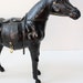 antique leather horse figurine