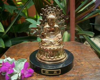 large plastic buddha statue