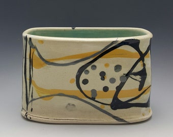 Handmade ceramic vase that can also be used as a utensil holder by Potteryi.