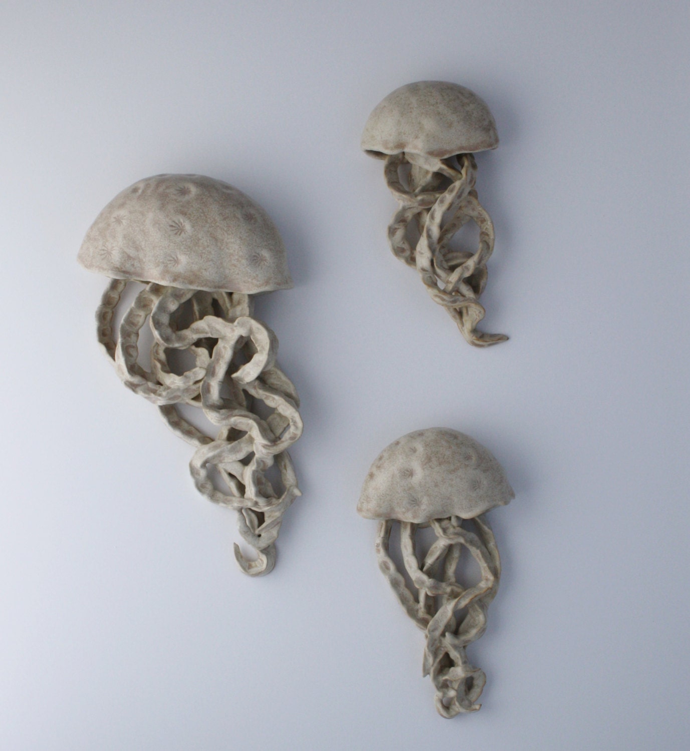 White ceramic wall sculpture. Jellyfish floating installation.