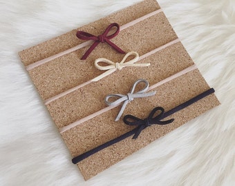 Set of four nylon baby headbands - suede lace - genuine - burgundy, beige,grey, black -one size fits all - small bows