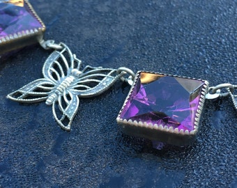 Vintage butterfly necklace with faceted violet stones