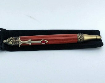 Gothika style pen trimmed in antique brass and turned from blood wood.