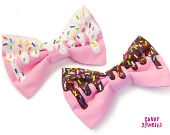 Melty baby pink colored candy hair bow with white frosting or chocolate & rainbow sprinkles