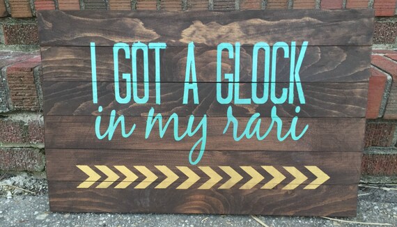 I got a glock in my rari wood sign