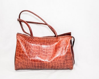 orange snakeskin purse