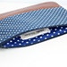 navy and white polka dot clutch bag