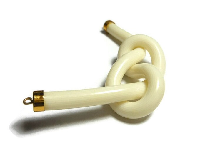 Cream knot focal charm, acrylic and gold-finished, opaque striated , 3" x1" knot, 2 loops, almost instant necklace or get creative