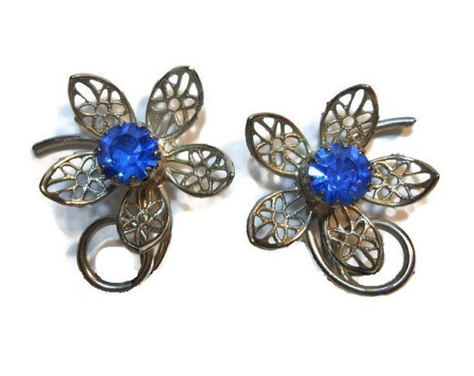 Cornflower blue floral earrings rhinestone center with silver tone filigree daisy petals, clip earrings
