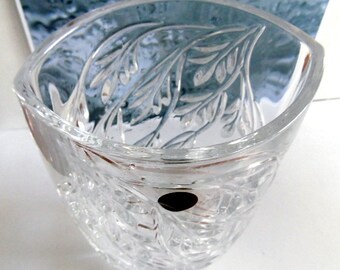 Lovely crystal vase, with unusual shape, and falling leaves design.