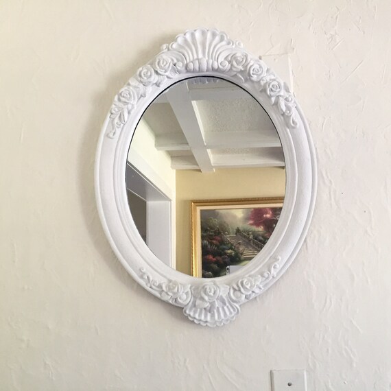 large ornate oval mirror large white