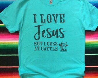 I Love Jesus but I Cuss At Cattle / cow / rancher / farmer / show steer / heifer / cowgirl / turquoise graphic tee t-shirt