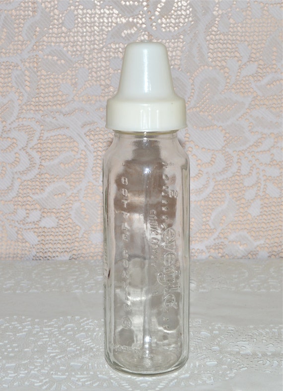 Items similar to Glass Baby Bottle Evenflo Vintage Baby Bottle White Plastic Lid Collectible