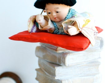 vintage asian doll with toy