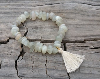 Gorgeous Moonstone stretch gemstone bracelet with tassel charm