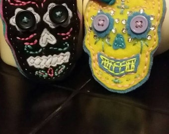 Hand stitched felt Dia de Los Muertos/ Day of the Dead sugar skull brooches. Also made to order.