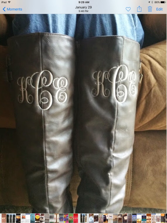 monogram plaque long leather boots