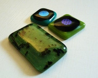 Set of 3 fused glass cabochons in various greens & black, with dichroic details