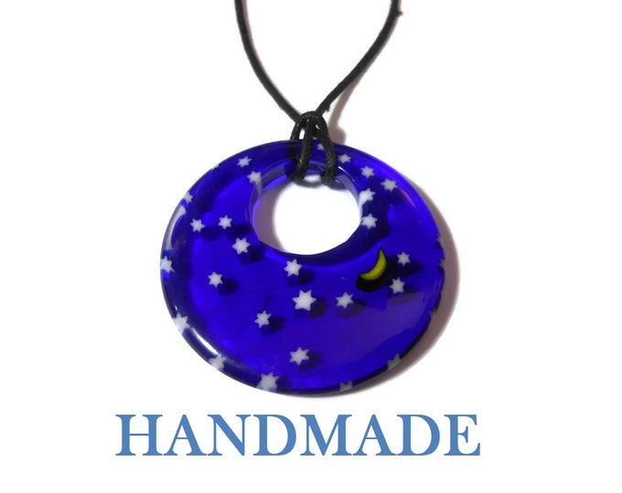 Millefiori glass pendant, 40mm round dark blue with field of stars and a yellow half moon, round go-go on black cord, silver plated findings