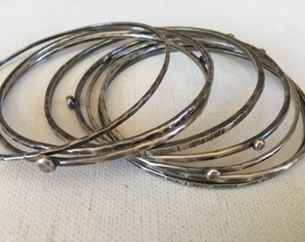 sterling silver bangles - hammered textured thick wire bracelets - set of seven bracelets - El Semanario