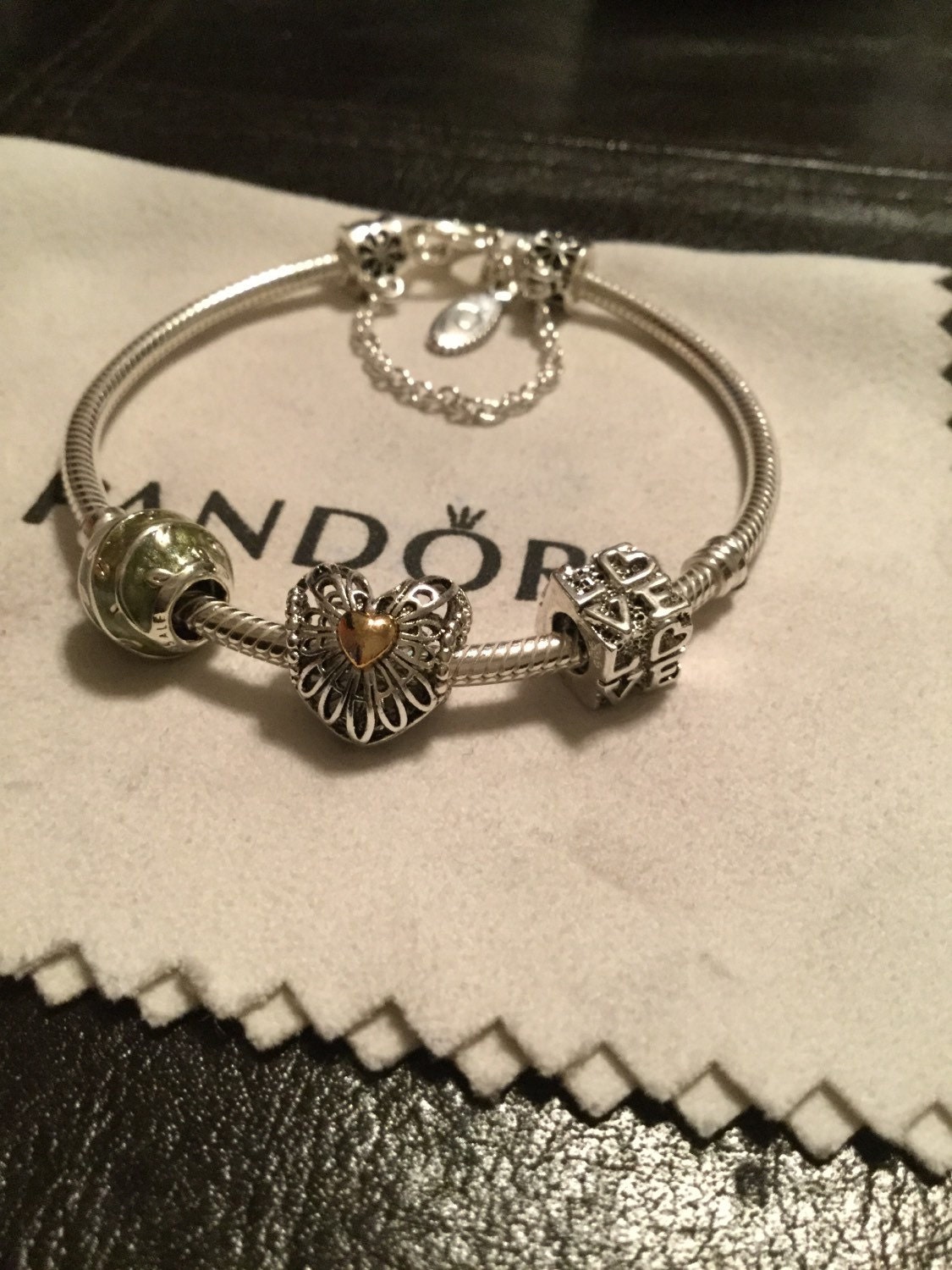 Authentic Pandora bracelet with mixed charms/safety chain