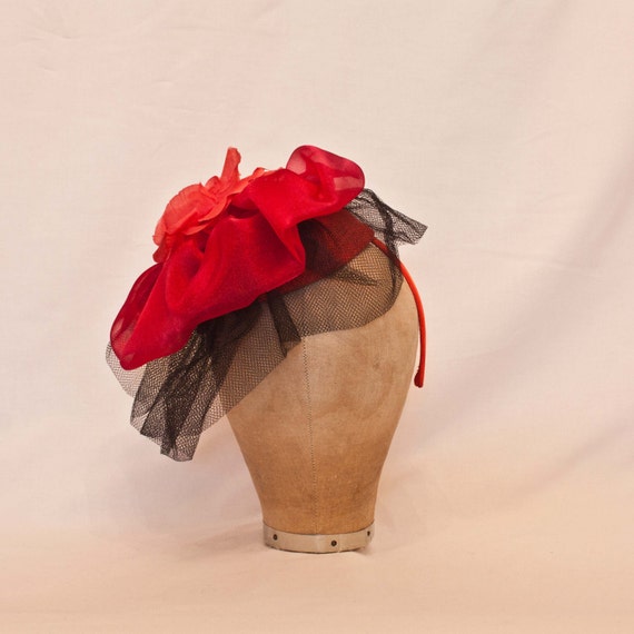 Handmade red and black ladies hat decorated with a red flower