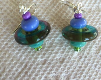 Lampwork Disc earrings with purple and seafoam green spacer beads and seed beads on sterling earwires.