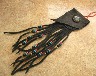 Black deerskin leather neck pouch with a teal and red glass mandala charm, 6" long fringe beaded with trade beads, 32" red nylon neck cord