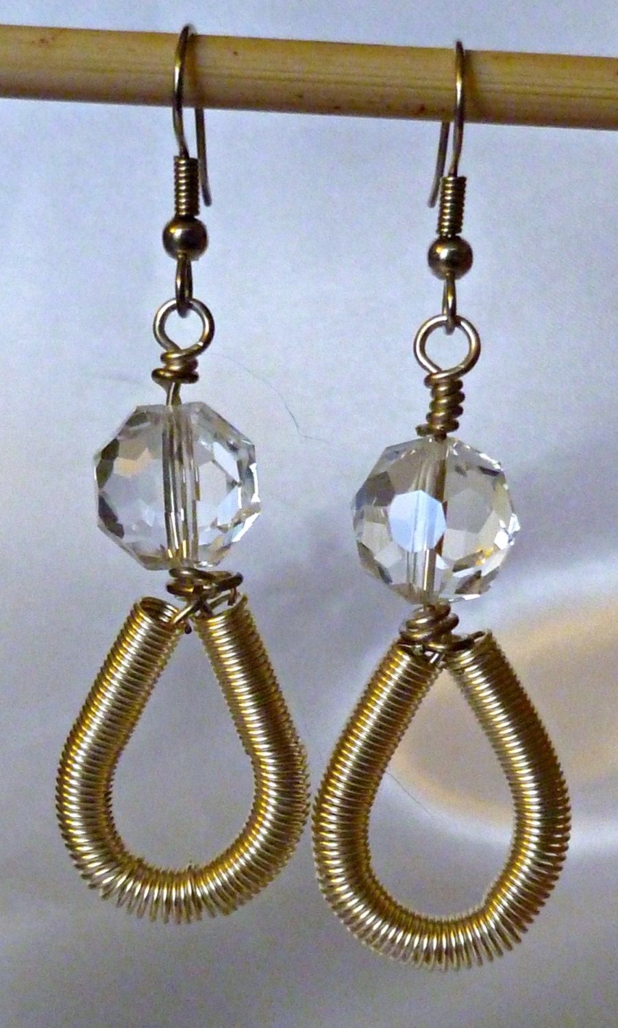 Gold wire coil loop dangle earrings with clear crystal accents