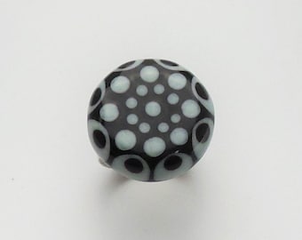 Fun handmade lampwork glass ring filled with black and white dots, great for the office or at play!