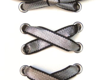 black shoelaces with silver tips
