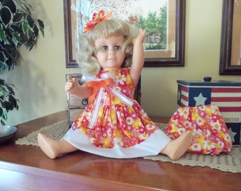 SALE****TWO Beautiful Dresses/Talking Doll With Blue Eyes is FREE