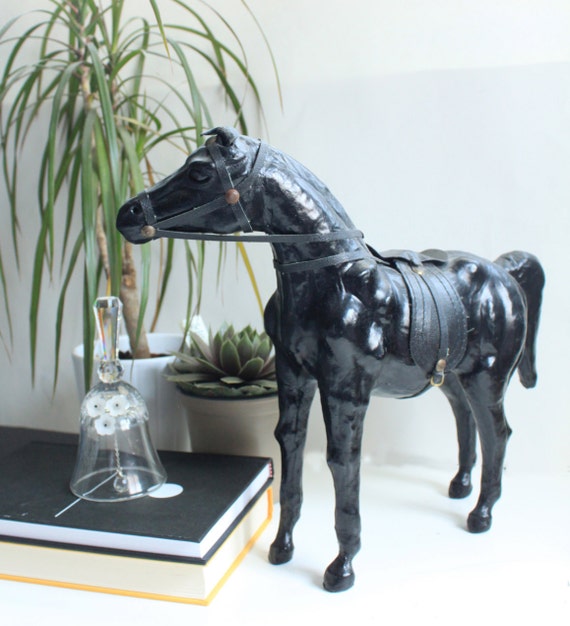 antique leather horse figurine