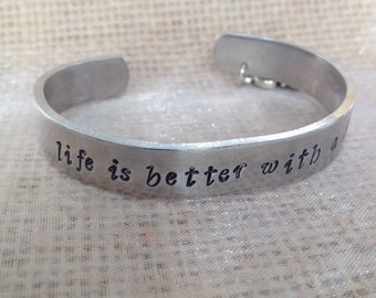 snoopy bracelet,hand stamped cuff "life is better with a dog" with or with out snoopy charm/ snoopy quote